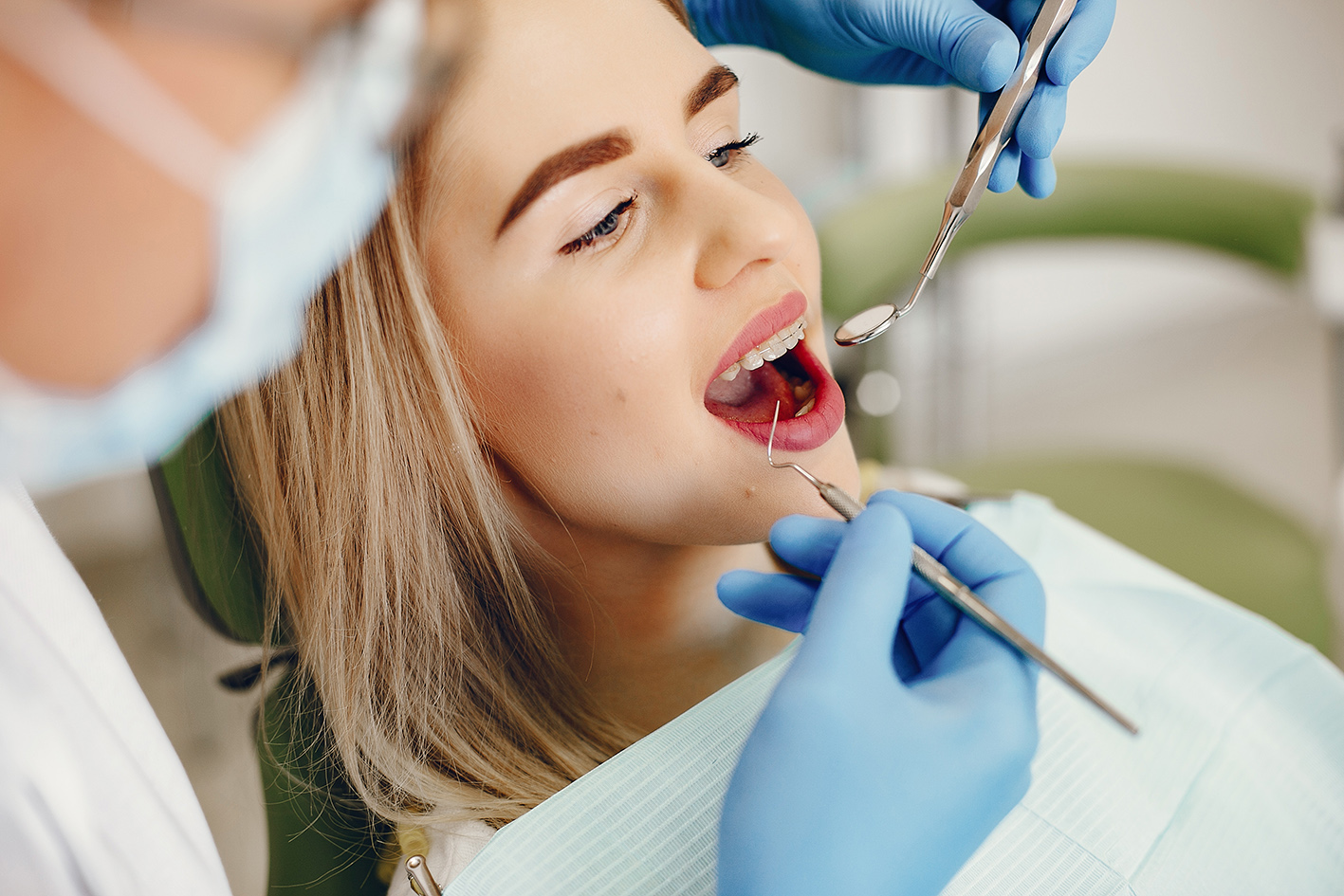 Beautiful girl sitting in the dentist’s office